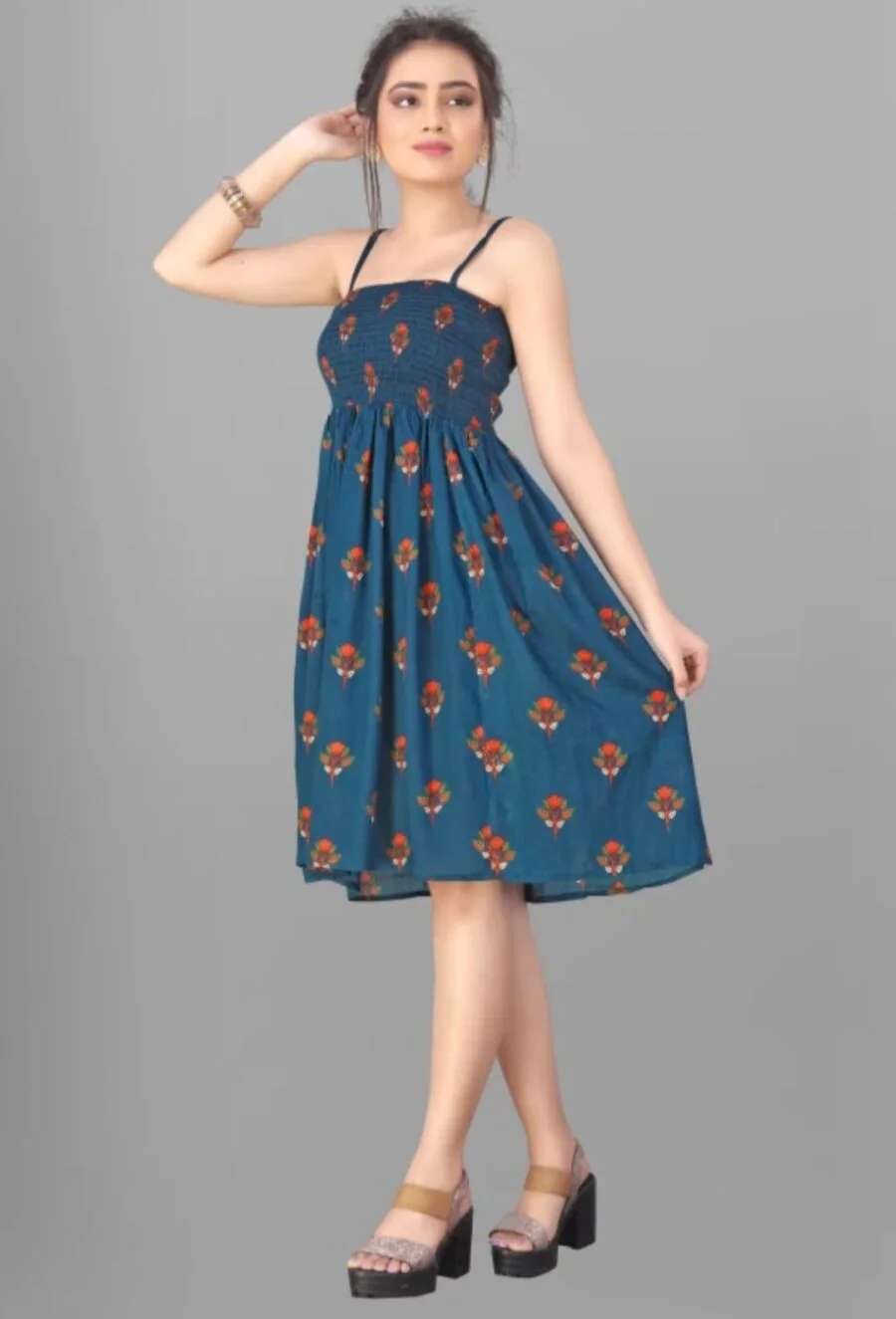 Playful Charm: The Teal Floral Smocked Mini Dress